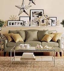But be sure to furnish the rest of the living room with smaller items as shown here in order to give the space a cohesive look. Love The Shelve Above The Sofa And The Way It S Decorated Home Decor Home Shelves Above Couch