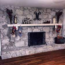 Painted Outdated Brown Stone Fireplace