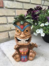 Hawaiian Wearing Tiki Mask Playing