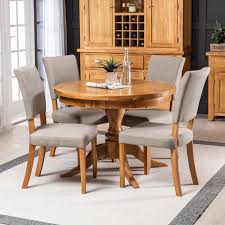 Katia mettle (dunnellon) said browse our wide range of dining tables and chairs is a traditional dining room table and chairs set too big and formal for your dining room? Solid Oak Round Dining Table And 4 Natural Fabric Dining Chairs The Furniture Market