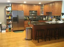 Traditional style kitchen with detailed raised paneled doors and above soffit. Advice For Cherry Wood Kitchen Cabinets Wood Flooring