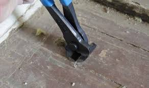 remove old carpet and flooring staples