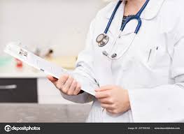 Female Doctor Holding Patient Chart Clipboard Stock Photo