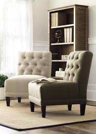 Additional furniture pieces can be added. A Button Tufted Armless Chair Is The Perfect Accent In A Sitting Area The Neutral Upholstery C Armless Chair Living Room Living Room Bench Living Room Seating