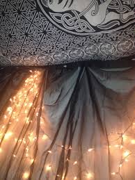 Hang Sheer Curtains Over Lights On The Wall To Create A Mood