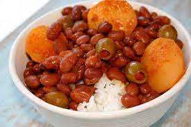 The tender pinto beans are simmered with potatoes and ham in a sofrito and tomato based sauce, then served over rice. Puerto Rican Rice Beans Recipe Yummly Recipe Sofrito Recipe Rice And Beans Recipe Boricua Recipes