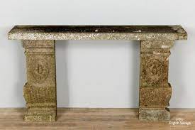 weathered carved stone garden console table