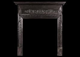 A Cast Iron Fireplace With Filigree