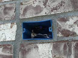 blue pvc box in exterior brick what