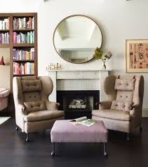 Round Mirror Above Fireplace