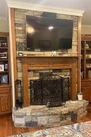 to decorate with a tv above your mantel