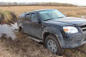Car stuck in mud how to get out. How To Get Your Stuck Car Out Of Snow Or Mud Motor Hills