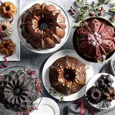 Cake pans with chocolate batter and mixer in background. Nordic Ware Anniversary Bundt Pan Williams Sonoma
