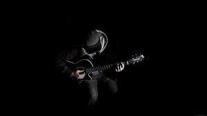 al10 out the dark guitar player