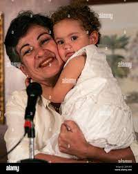 Colombian politician Consuelo Gonzalez carries her grandchild Maria Juliana  while attending a news conference in Caracas January 11, 2008. The  Revolutionary Armed Forces of Colombia, or FARC, on Thursday freed Colombian  politicians