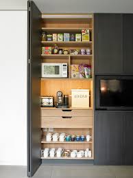 As an option, their hawaturnaway hardware will retract a full size and thickness door into a closet, similar to the old big tv entertainment unit retracting doors. Breakfast Cabinet With Bi Fold Doors Contemporary Kitchen London By Brayer Design Houzz