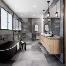 Its neutral trait makes it easy to combine gray with other colors. A Cloudy Grey Tile Sets The Palette For This Bathroom