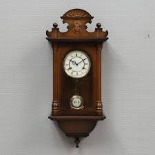 A Wooden Wall Clock Ra 20th Century