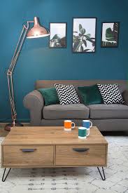 living room with grey sofa coffee
