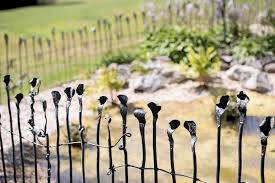If you want to have a steel wire fence with better privacy, this idea shows you the easy way to make it. All About Metal Fences This Old House