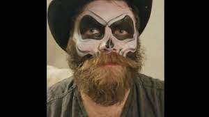 skull paint on a bearded man you