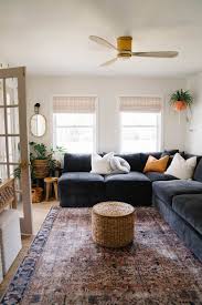 small cozy living room with black sofa