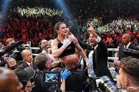 Katie Taylor retains title in historic ...