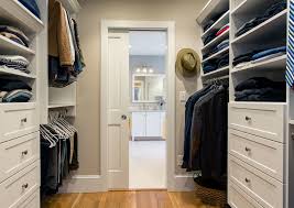 Opening the door into the closet doesn't make a lot of sense, because the door would have to block some of the clothes. Master Suite With Walk Through Closet Traditional Closet Boston By Doucet Remodeling Design Houzz
