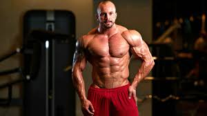 feature bodybuilder posing in diffe poses demonstrating their muscles how to bulk up