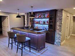 Stay entertained while staying at home. Custom Home Bar With Stone Accents Basement Bar Designs Home Bar Rooms Basement Bar