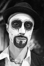 man with skull makeup bindis dia de