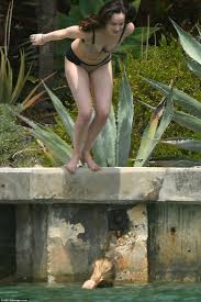 Dakota Johnson looks sensational in black bikini in Miami Daily.