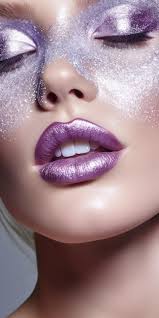 purple makeup and glitter on her lips