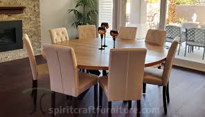 Reclaimed wood dining table with contemporary metal base. Round Custom Made Solid Wood Dining Conference Tables