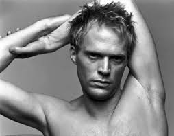 Random citizens are seen watching various episodes of black mirror through their eyes, while riding the train, waiting at the airport, standing by the sea, talking to a parent on their deathbed, all the while bearing frozen smiles and vacant white eyes. Picture Of Paul Bettany
