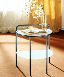 A Coffee Table On A Metal Frame With