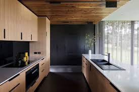 75 dark wood floor kitchen with light