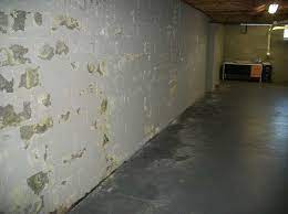 paint ling off of the basement walls