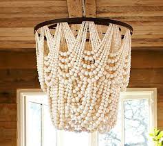 Do you love the look of the beaut all wooden bead chandeliers but just can't justify the price? Amelia Indoor Outdoor Wood Bead Chandelier Wood Bead Chandelier Diy Chandelier Beaded Chandelier