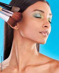 makeup brushes and indian woman with