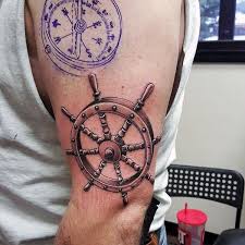 For example, the compass and rose tattoo is a small play on. 3d Ship Wheel Nautical Upper Arm Tattoos For Men Nautical Tattoo Helm Tattoo Tattoos For Guys