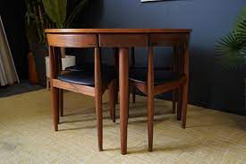 teak dining table with tuckaway chairs