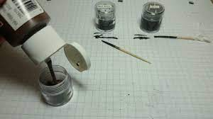 Insert the bolt shaft into the center hole until it is flush with the bottom of the 1/2 hole, and then secure it with hot glue. Diy Conductive Paint Good Idea On Paper