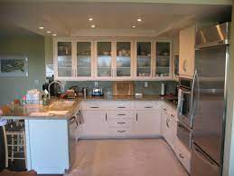 Not only does refacing kitchen cabinets require reusing your existing cabinet boxes, it means that you cannot change the layout or design of your existing kitchen. Kitchen Tune Up Ventura Glass Kitchen Cabinet Doors Replacing Kitchen Cabinets Glass Kitchen Cabinets