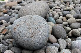 Big Stones Among Smaller Pebbles In