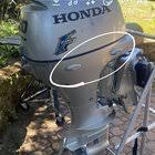 can i lay honda outboard fourstroke on