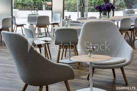 Godrej interio modern cafe chair, seating capacity: Grey Modern Cafe Chairs Stock Photo Adobe Stock
