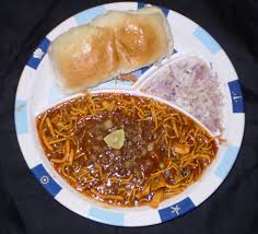 Misal pav is a vibrant meal consisting of a spicy sprouted bean curry topped with crunchy farsan, crisp red onions and fresh cilantro that is served with lightly buttered pav or dinner rolls. Misal Pav Mumbai Special Nutan S Kitchen