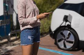 But i would highly recommend downloading google voice from the. Mid Section Of Woman Using Mobile Phone While Charging Electric Car At Service Station Stock Images Page Everypixel
