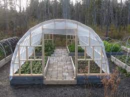 Build this epic model of pvc pipe greenhouse at home that will cost you only $50 dollar but will provide all the pro features you want to see in a greenhouse! Diy Greenhouse The Owner Builder Network Cheap Greenhouse Greenhouse Plans Greenhouse Farming